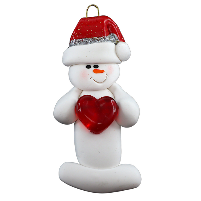 Ornament of white snowman in red hat holding a shiny red heart.