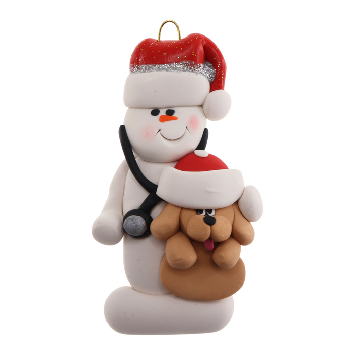 Ornament of white snowman in red hat holding a tan dog and stethoscope.