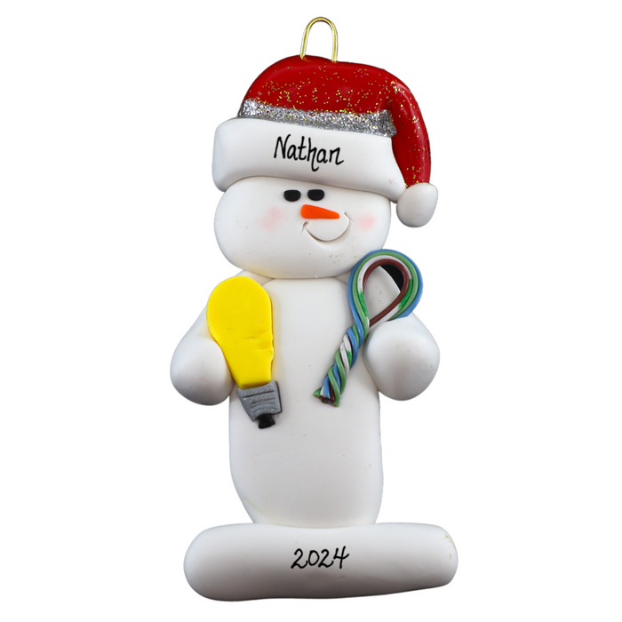 Ornament of white snowman in red hat holding a lightbulb and coil of wire, personalized with name.