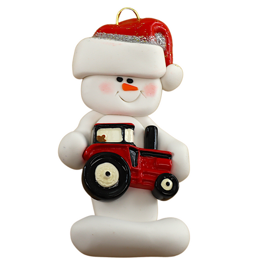Ornament of white snowman in red hat holding a red tractor.