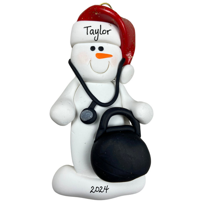 Ornament of white snowman in red hat holding a stethoscope and black medical bag, personalized with name.